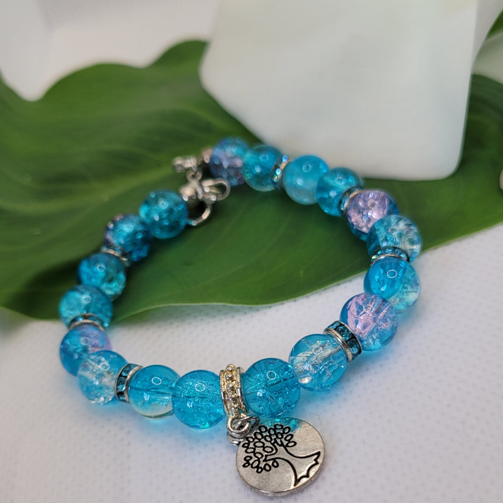 Bracelet pvc bleu en perles de verre craquelées et arbre de vie 